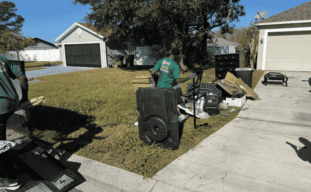 a man sitting on a bench in a yard